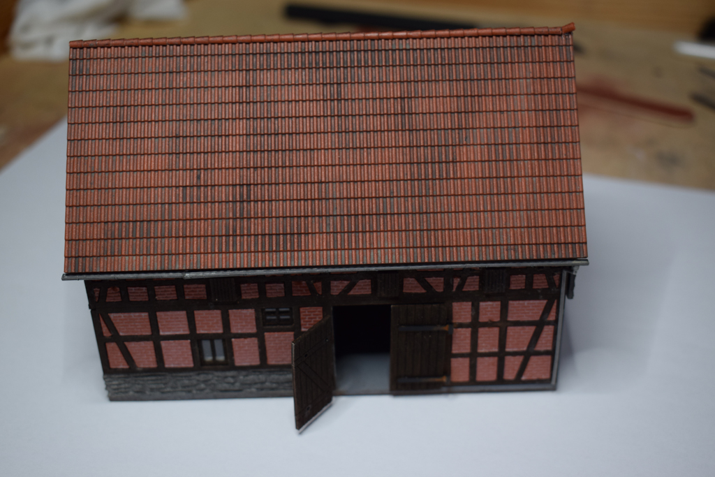 Haus mit Stall Busch (1506).
Auch wie die anderen Häuser dieser Serie in Ziegel/Fachwerkbauweise mit Natursteinsockel.